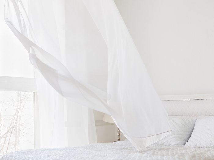 How to cool down a room without ac - blowing white curtain