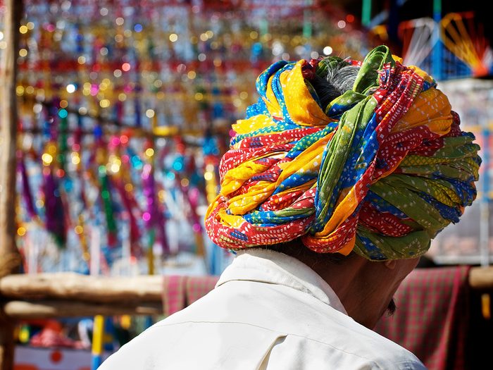 Travelling to India from Canada - man in colourful turban in Pushkar Market