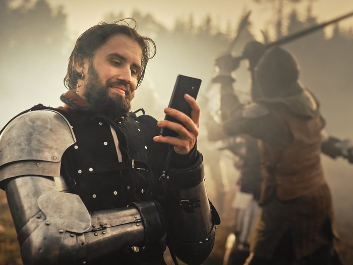 History Jokes - funny medieval knight with phone