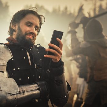 History Jokes - funny medieval knight with phone