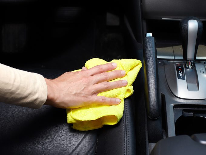 How to clean car seats - Hand cleaning car seat.