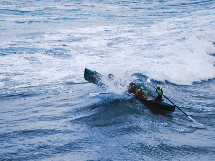 Ocean words - rowing boat into crashing waves