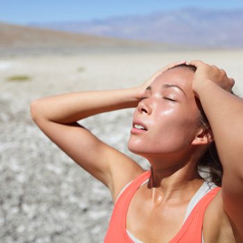 Sweating woman - physical activity in summer