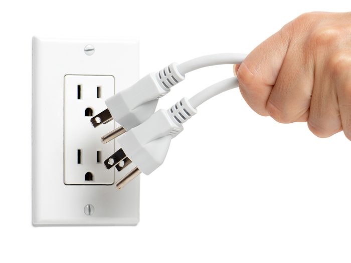 Unplugging cords from wall power outlet
