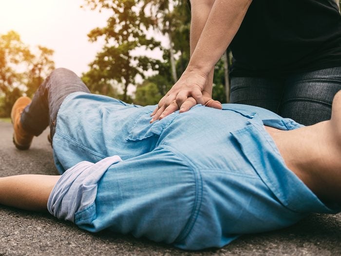 Man administering CPR to victim