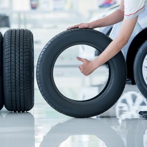 What numbers on tires mean - mechanic replacing tires