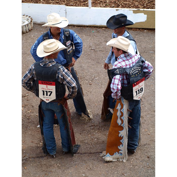 Candid photography - Calgary Stampede cowboys talking