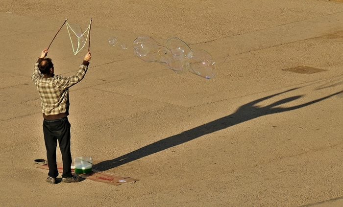 Candid photography - Man making bubbles