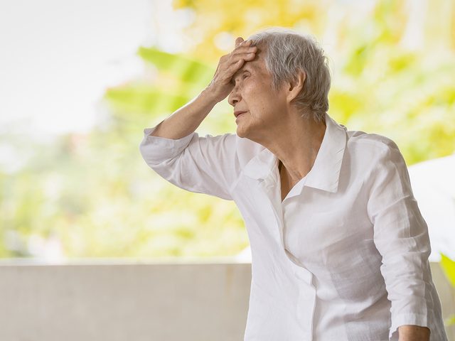 Heart attack symptoms - senior woman sweating