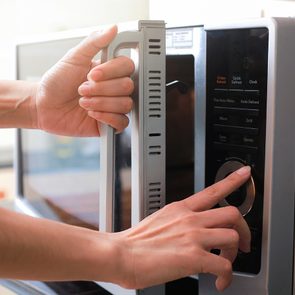 Microwave tricks - woman using microwave
