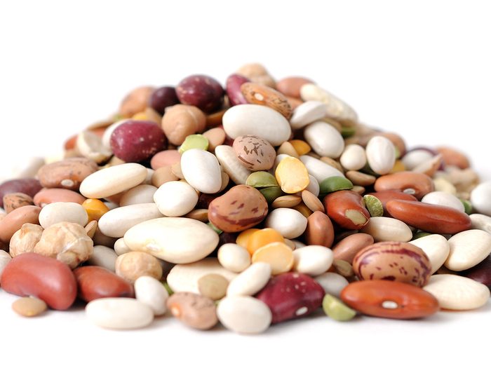 Spill the beans - mix of beans on white background