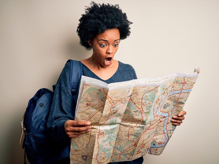 Travel mistakes everyone should make - woman looking at map