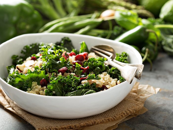 Best vegetables for weight loss - Healthy raw kale and quinoa salad with cranberry and almonds