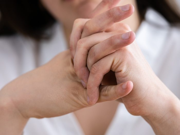 Is cracking your knuckles bad for you - Woman crackling knuckles