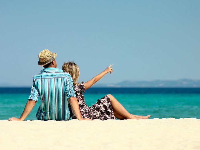 Take a vacation - couple on beach