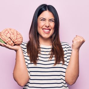 Boost your brain - woman holding brain