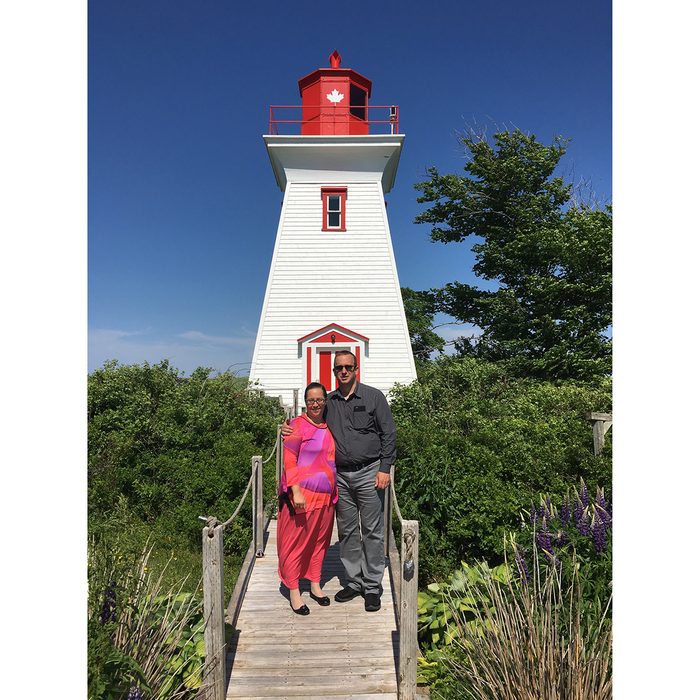 Couple standing in front of PEI Lighthouse