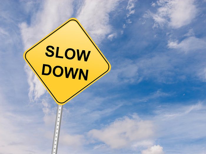 How to improve gas mileage - slow down sign