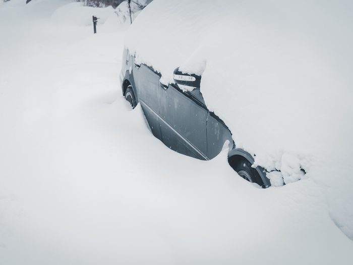 Car break down in winter - car buried in snow
