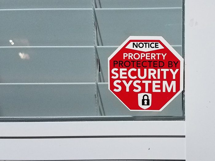 Home security system sticker on door