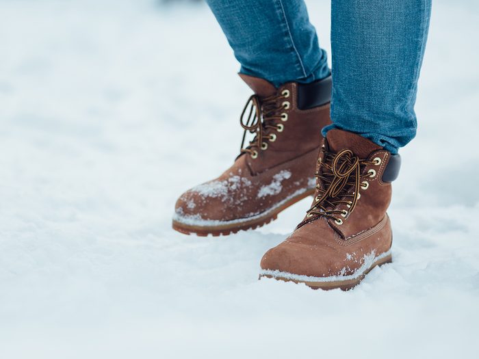 Winter boots walking through snow