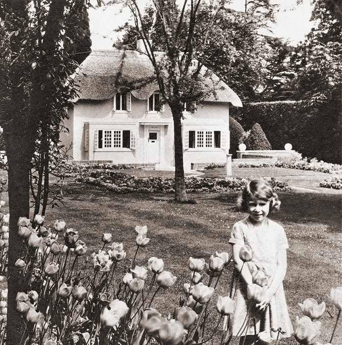 Princess Elizabeth At Y Bwthyn Bach Or The Little House, Situated In The Garden Of The Royal Lodge, Windsor Great Park, Berkshire, England. This Miniature Cottage Was A Gift To Her From The People Of Wales. Princess Elizabeth, Future Queen Elizabeth Ii,