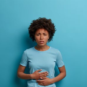 Can Stress Cause an Ulcer - Woman with stomach pain