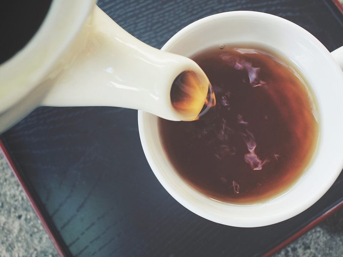 Health benefits of tea - pouring tea into teacup