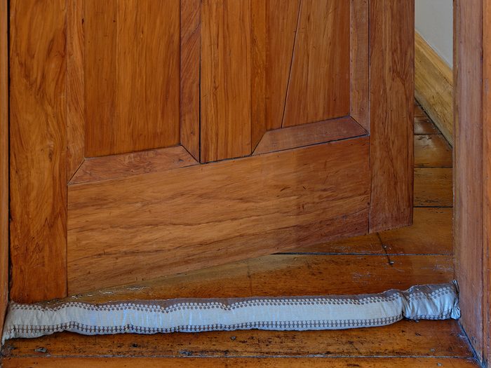 Home heating bills Canada - door with draft snake