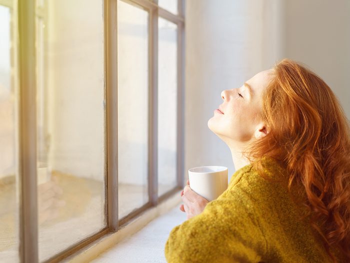 How to beat seasonal depression - woman basking in sunlight