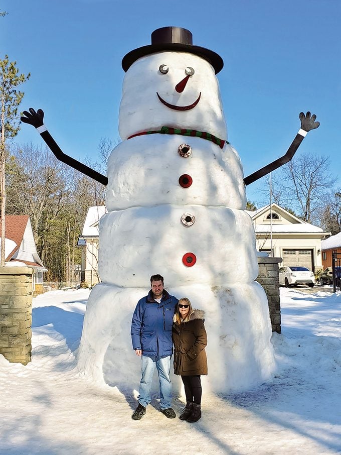 Marlene and her son, Al Hruska, posing with a big friend in Tiny Township, Ont.