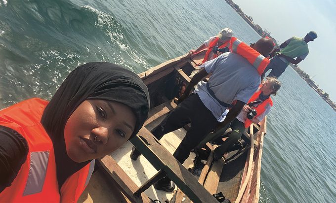 The author, Toufah Jallow, on a boat.
