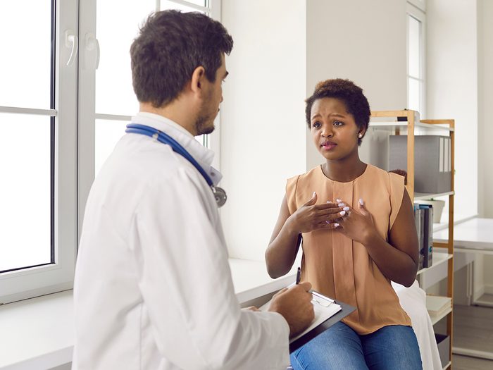 Woman speaking with doctor 