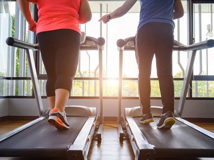 Couple working out on treadmill