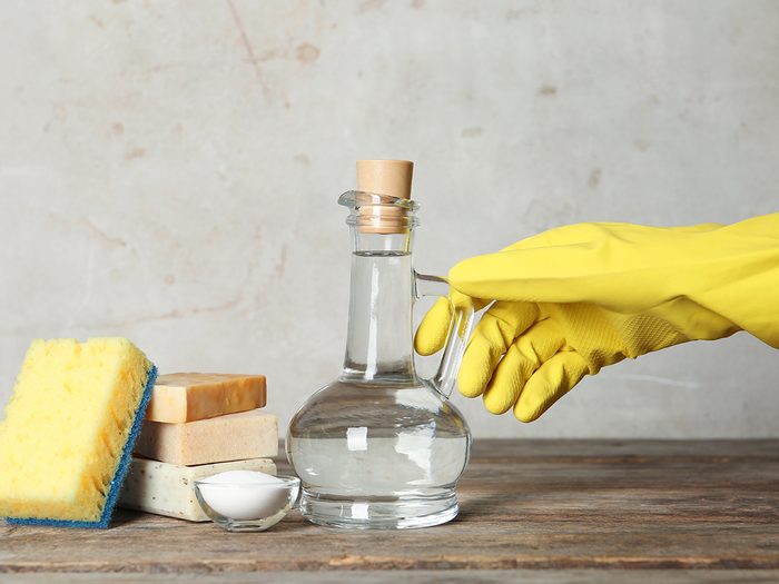 Never use vinegar to clean this - rubber glove