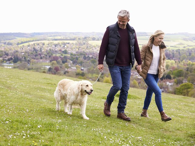 Reverse heart disease - active couple walking dog