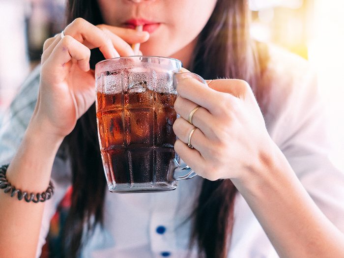 Signs of diabetes - woman drinking cola
