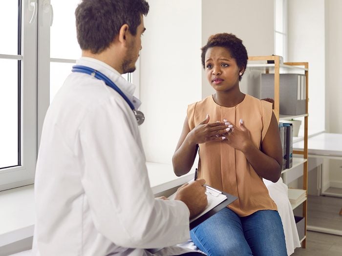 Woman speaking with doctor