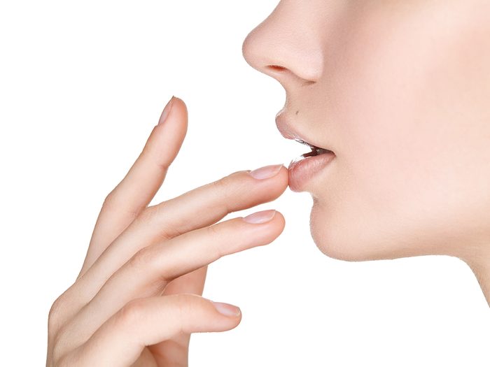 Woman touching her lips