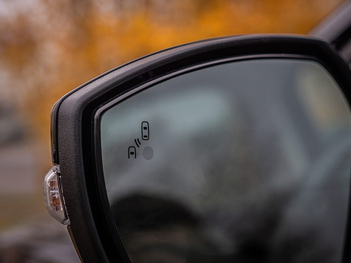 Car features - blind spot monitoring on side mirror