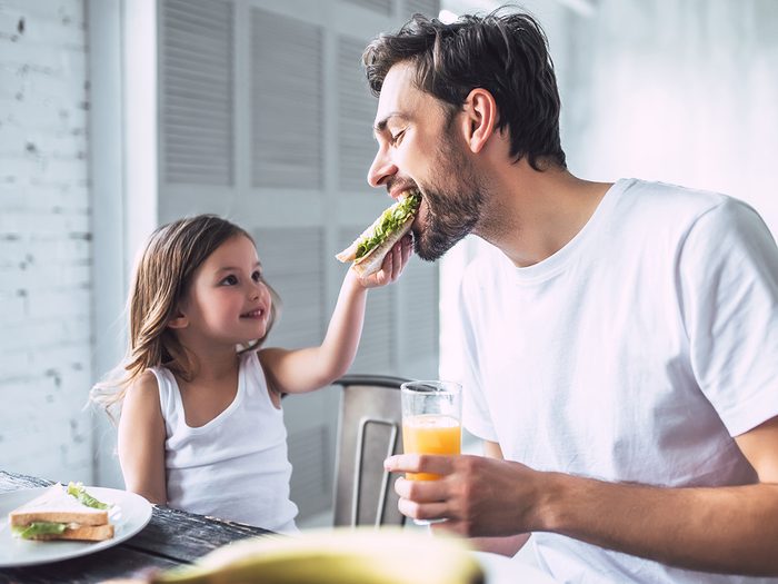 Healthy home - father and daughter eating together