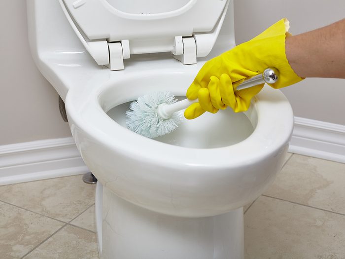 How to clean bathroom - cleaning toilet with brush