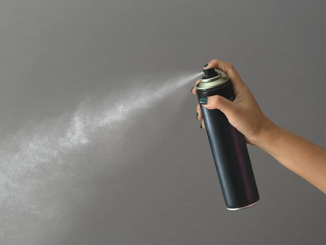 Spraying hairspray