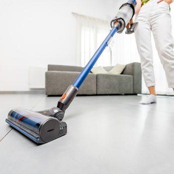 Things you should never vacuum - woman vacuuming