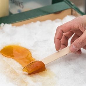 Maple syrup farm - Maple taffy on snow at the sugar shack, in Montreal, Canada (2017)