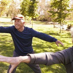 Exercises for seniors - senior couple doing tai chi in park