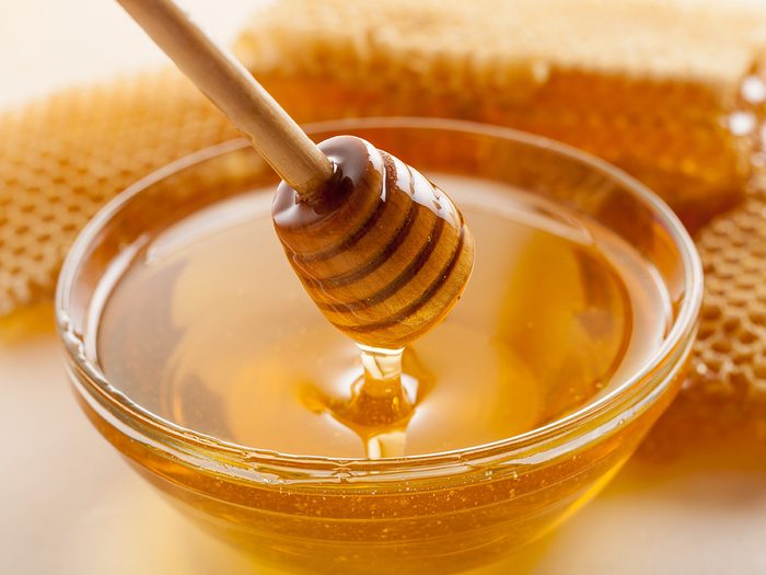 Honey in bowl with spreader