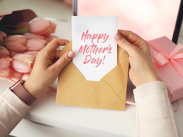 Woman opening Mother's Day card