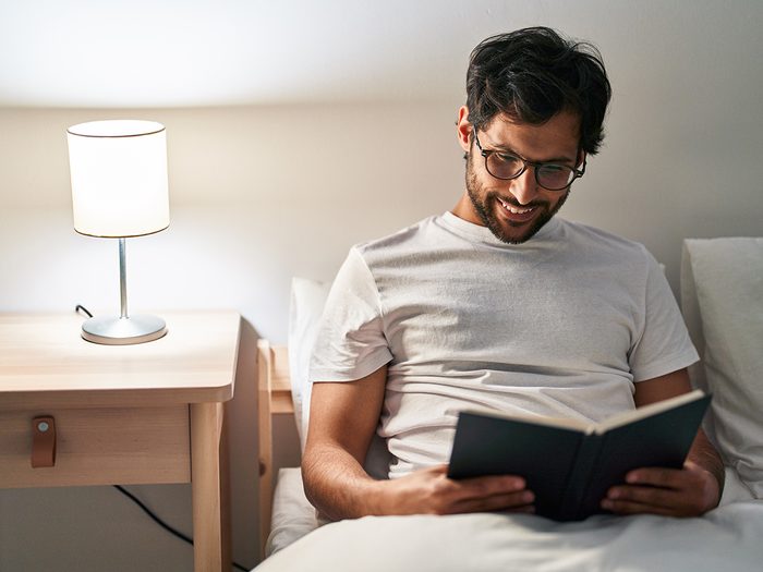 Natural sleep aids that work - man reading in bed