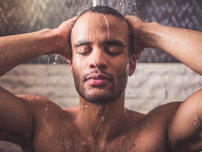 Natural sleep aids that work - man taking warm shower